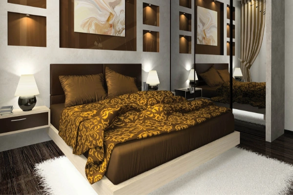 the luxurious brown motif and the plush headboard of this bedroom take elegance to the next level